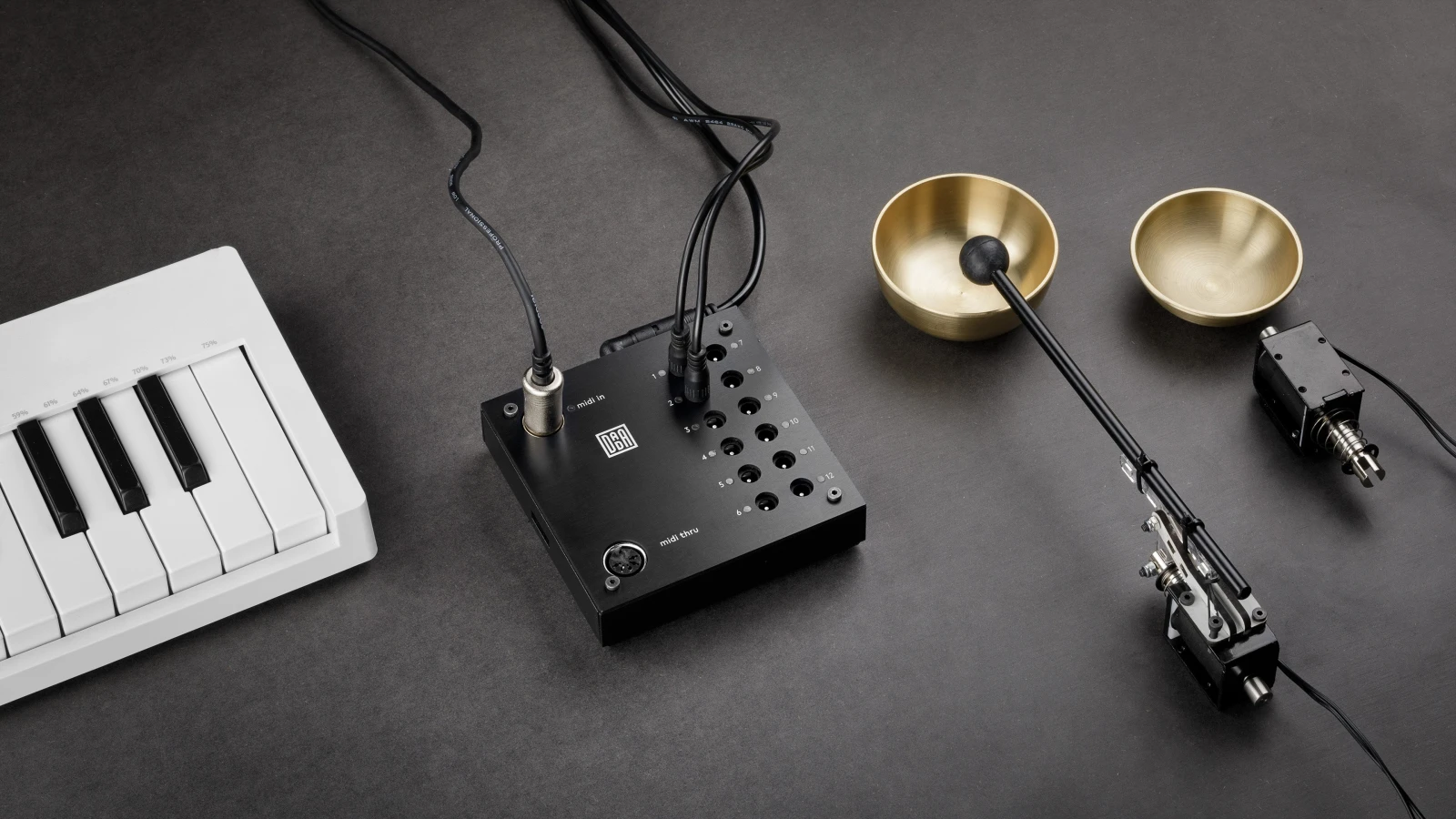 Automat controller connected to a MIDI keyboard and solenoid beaters playing brass bowls